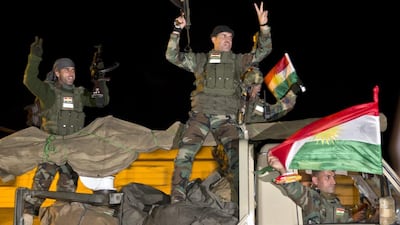 Iraqi Kurdish peshmerga fighters on their way to Kobani, also known as Ayn Arab, to fight ISIL (AP Photo/Vadim Ghirda)