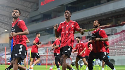 UAE defender Khalifa Al Hammadi (c) trains at the Abdullah bin Khalifa Stadium in Doha ahead of the national team's 2022 World Cup play-off against Australia on Tuesday. Photo: UAE FA