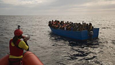 Migrants and refugees are assisted by members of the Spanish NGO Proactiva Open Arms on February 3, 2017, as they crowd a boat adrift in the Mediterranean Sea about 34 kilometres north of Sabratha, Libya. European Union leaders said they are poised to take a big step on Friday in closing off the illegal migration routes from Libya across the central Mediterranean, where thousands have died trying to reach the EU. Emilio Morenatti / Associated Press