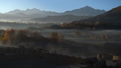 Afghan men ride bikes along a road in the old city of Bamiyan. Wakil Kohsar / AFP