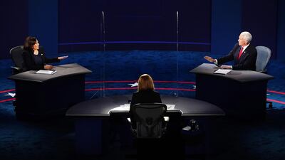 Senator Kamala Harris and US Vice President Mike Pence both gesture as they debate during the Vice Presidential debate at the University of Utah's Kingsbury Hall in Salt Lake City, Utah, October 7, 2020. EPA