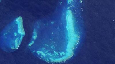 What begins with J? Jason-1 and the jet stream. Jerusalem, Jakarta, and Johnson Space Center. This jade-colored coral reef juxtaposed against the jumble of the sea. On July 17, 2015, the Operational Land Imager on Landsat 8 captured this image of the Trunk Reef near Townsville, Australia. Courtesy NASA