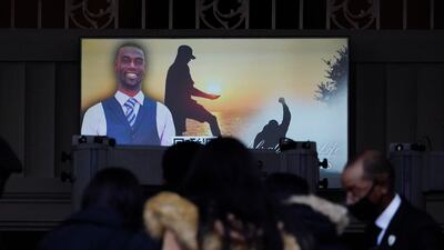Mourners watch a video celebrating the life of Mr Nichols, who was beaten by Memphis police officers and later died from his injuries. AP