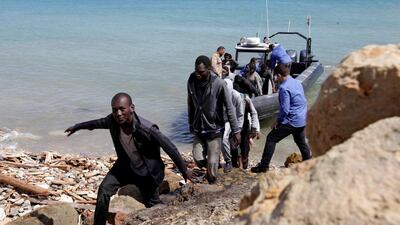 Migrants disembark a boat after they were rescued by the Libyan coast guard, at a naval post in the coastal town of Tajoura, east of Tripoli, Libya on May 23, 2017. Ismail Zitouny/Reuters