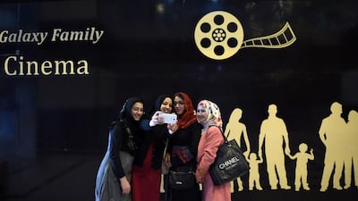 Afghan women take a ‘selfie’ after watching a Hollywood movie at the Galaxy Family Cinema in Kabul in November 2016. Shah Marai / AFP Photo