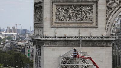Workers are preparing the famed Paris monument for the project called 'L'Arc de Triomphe, Wrapped' by late artist Christo. AP
