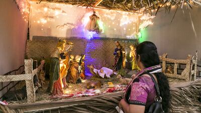 A nativity scene at St Joseph’s Cathedral compound on Christmas Day. Churches across Abu Dhabi and throughout the emirates were busy as Christians flocked to masses and services to mark the birth of Jesus. Reem Mohammed / The National