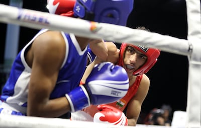 India's Raveen beat Ali Hassan Sumon of Bangladesh in Al Ain via third-round stoppage. Pawan Singh / The National
