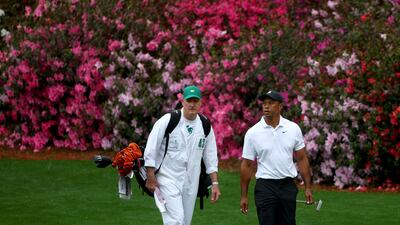 Tiger Woods with his caddie Joe LaCava on the 13th hole. AFP