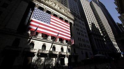Although the markets surprised forecasters last year, the predictions may eventually prove correct. Above, the New York Stock Exchange. Seth Wenig / AP Photo