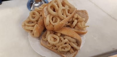 A calamari sandwich makes for a delicious and cheap local snack in Madrid.