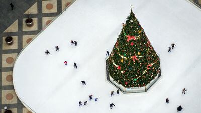 People skate around the Christmas tree at the Rink at PPG Place, in downtown Pittsburgh. AP Photo