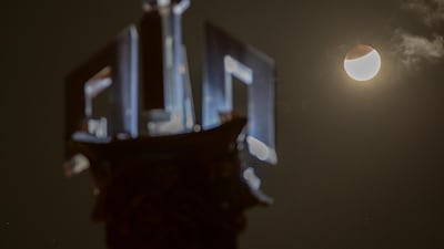 The moon rises against a tower with the name of God in Arabic "Allah," in Islamabad, Pakistan. AP Photo/B.K. Bangash