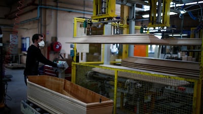 An employee works on a coffin at the manufacturing plant OGF in Jussey as the spread of the coronavirus disease continues in France. Reuters