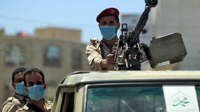 A Yemeni soldier loyal to the Houth rebels mans a machine gun turret in the back of a pickup truck during a patrol in the capital Sanaa on March 23, 2020. AFP
