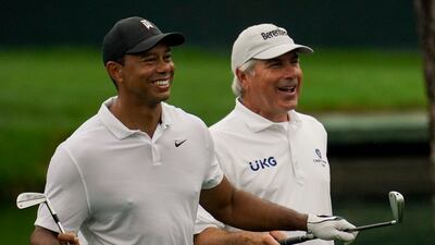 Tiger Woods with Fred Couples on the 16th hole. AP