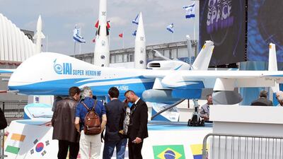 Visitors are gathered in front of an Israeli made drone Super Heron HF, at the Paris Air Show. Remy de la Mauviniere / AP Photo