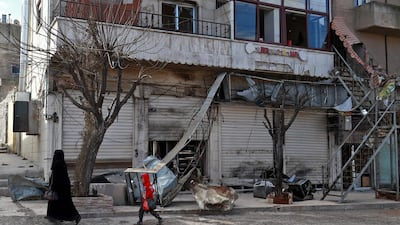 The aftermath of a suicide attack targeting US-led coalition forces in the flashpoint northern Syrian city of Manbij which killed four US serviceman. Delil Souleiman / AFP