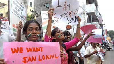 August 18, 2011: Supporters of Anna Hazare carry placards in support of his anti corruption movement in Chennai, India. Hazare used a four-day fast to force the government to draft a legislation to create an anti-corruption watchdog in April 2011. He had???