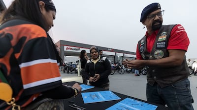 Members sign special commemerative boards and certificates of participation