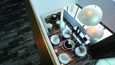 Throughout the apartment, the designers have used long, rectangular strips of Italian cappuccino marble to evoke the warmth of wood, along with the opulence of stone flooring.