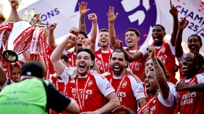 Arsenal player Declan Rice and teammates celebrate their Premier League victory. EPA
