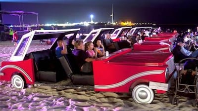 Formula One fans watch the movie Speed Racer on the Abu Dhabi Corniche during the Cinema by the Sea event last year.