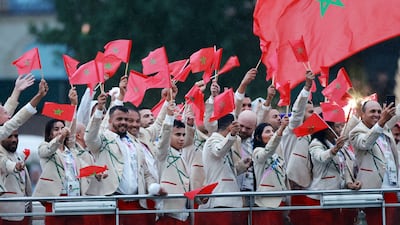 Athletes from Morocco wave flags. Reuters