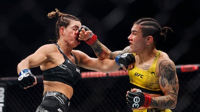 Jessica Andrade connects with a punch on Mackenzie Dern during their strawweight fight. AFP