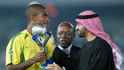 Sheikh Mohamed bin Zayed presents Brazil captain Dudu Cearense with the trophy after his team beat Spain in the 2003 Fifa World Youth Championship final at Zayed Sports City Stadium. AFP