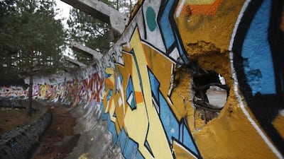 In this picture taken on February 21, 2014, the bobsleigh track damaged by artillery fire is painted with graffiti at Mt. Trebevic near Bosnian capital of Sarajevo. Wartime destruction and negligence have turned most of Sarajevo’s 1984 Winter Olympic venues into painful reminders of the city’s golden times. The world came together in the former Yugoslavia in 1984 after the West had boycotted the 1980 Olympics in Moscow and Russia boycotted the 1984 Summer Games in Los Angeles. Just eight years later, the bobsleigh and luge track on Mount Trbevic was turned into an artillery position from which Bosnian Serbs pounded the city for almost four years. Today, the abandoned concrete construction looks like a skeleton littered with graffiti. Amel Emric / AP Photo