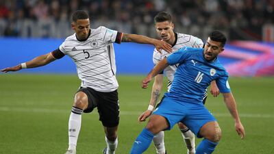 Germany defender Thilo Kehrer and midfielder Julian Weigl attempt to tackle Israel midfielder Mohammad Abu Fani. AFP