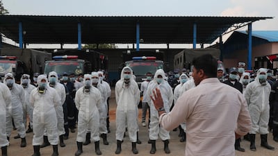 Director Disaster Response Force of Telangana State Vishwajeet Kampati gives instructions to members of his team prior to spraying disinfectants as a precautionary measure against Covid-19 in Hyderabad, India. AP Photo