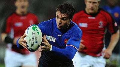 Vicent Clerc makes sure he has control of the ball in slippery conditions during France's 46-19 win against Canada.
