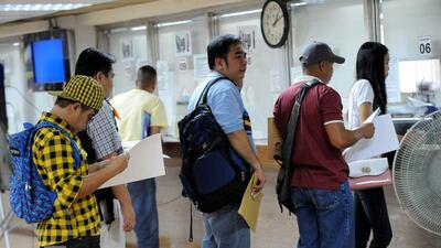 The one-stop service centre opened on Monday at the Poea building in Mandaluyong City, east of capital Manila. Jay Directo / AFP