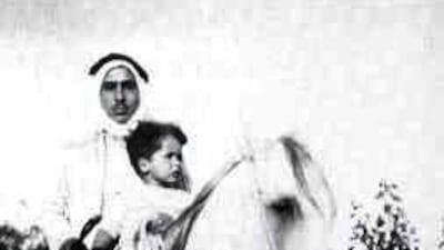 King Hussein riding a horse with his father Talal ibn Hussein in 1939. AFP