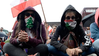 Protesters listen to a speech by President Michel Aoun in Jal El Dib, north of Beirut. EPA