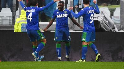 Sassuolo's Ivorian forward Jeremie Boga (C) celebrates with teammates after scoring. AFP