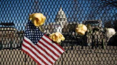 Flowers on a fence, a week after a pro-Trump mob broke into and took over the Capitol, in memory of slain Capitol Police Officer Brian Sicknick, in Washington, January 14, 2021. AFP