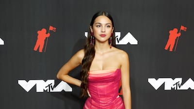 US singer Olivia Rodrigo, in Versace, arrives on the MTV Video Music Awards red carpet.