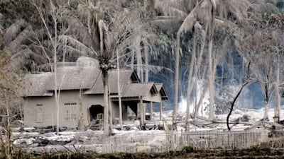 A house is covered with volcanic ash in Argomulyo, Yogyakarta, the closest city with an airport to the capital Jakarta, where the airfields have been closed.
