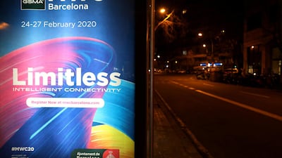 A banner of MWC20 (Mobile World Congress) is pictured at a bus stop along a street in Barcelona, Spain. REUTERS/Nacho Doce