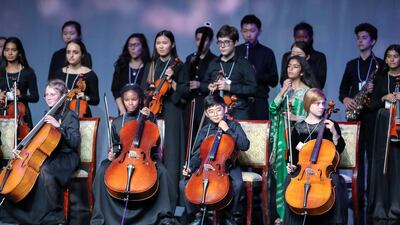 Musicians prepare to play at the event. Victor Besa / The National