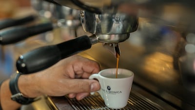 An espresso cup is prepared at a restaurant in Sao Paulo, Brazil. Coffee is among the products that rose in price recently, eroding the buying power of consumers. AP