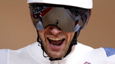 Britain's Jason Kenny celebrates taking gold.