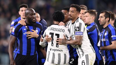 Inter Milan's Romelu Lukaku and Juventus' Juan Cuadrado argue following their Coppa Italia semi-final first leg on Tuesday, April 4, 2023. AP