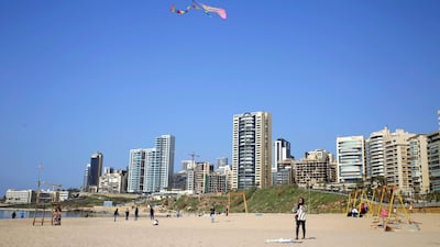 A girl flies a kite at the public beach of Ramlet al-Baida in in Beirut, Lebanon, Sunday, Feb. 26, 2017. AP