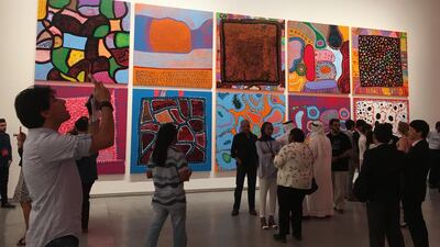 Yayoi Kusama’s artwork comprising three giant red balls with white polka dots on them. Anna Seaman / The National