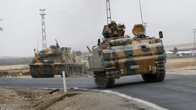 Turkish tanks return from Syria to Turkey on August 25, 2016, following the operation to recapture Jarabulus. Sedat Suna/EPA