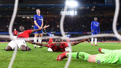 Paul Pogba celebrates with Romelu Lukaku as he scores Manchester United's second goal. Getty